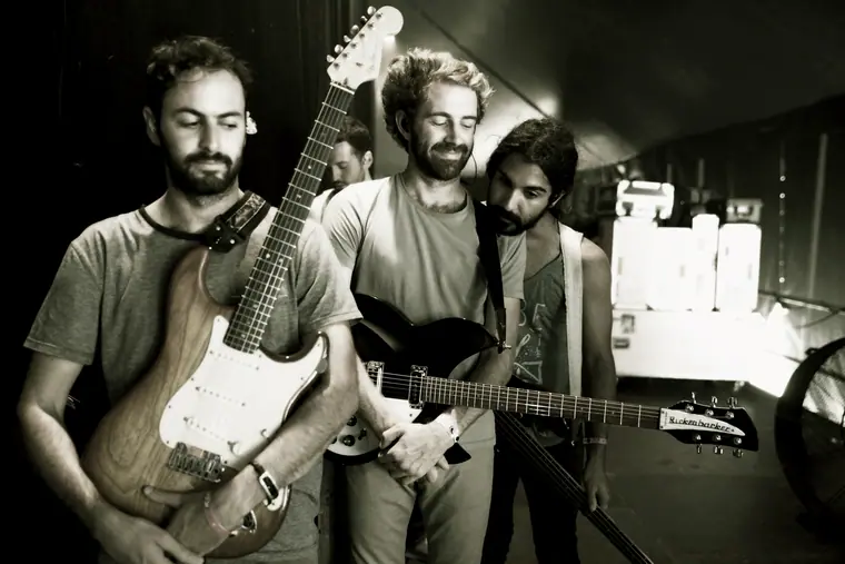 Young the Giant backstage with guitars